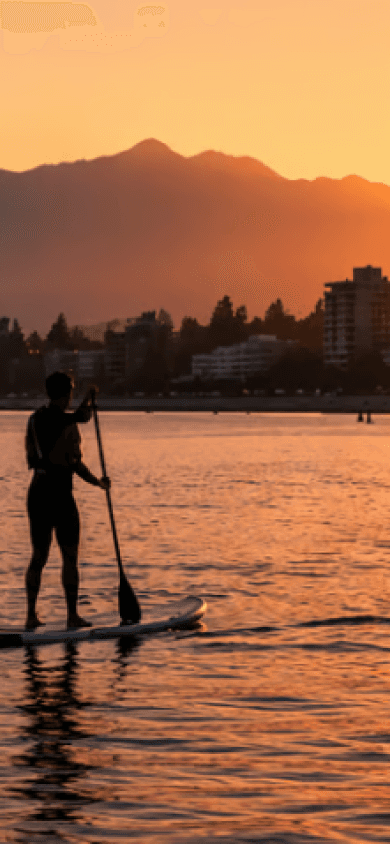 Paddleboarding at sunset on a Vancouver beach